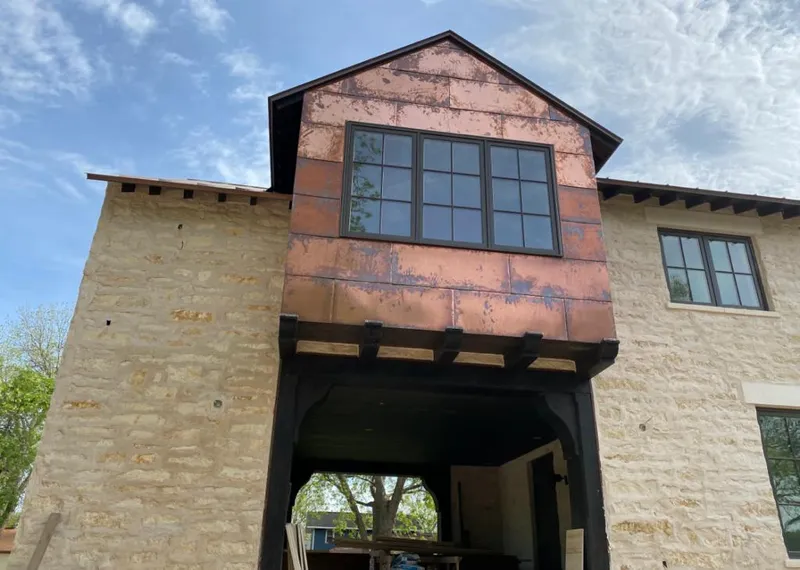 Copper metal panel facade on a stone building for Metal Roof Coating in Radcliff